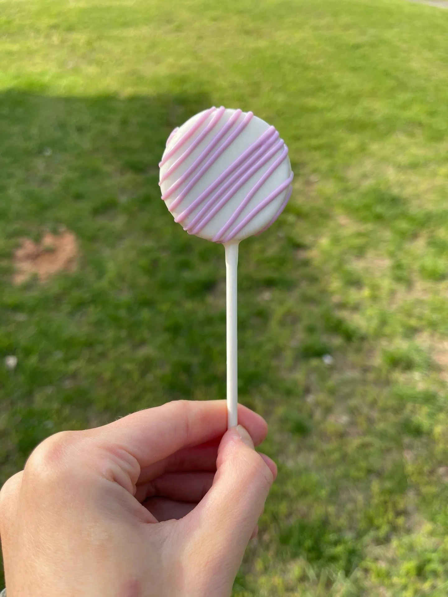 White chocolate cake pop with lavender drizzle